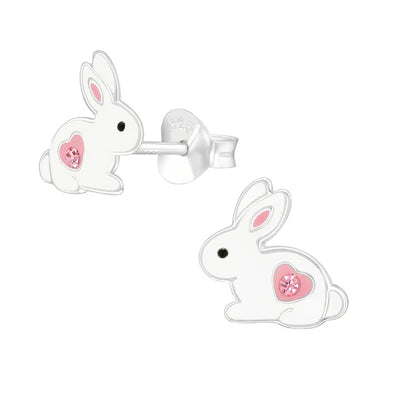 White rabbit-shaped earrings with pink hearts on a white background