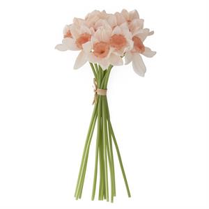 Bouquet of artificial flowers with peach-colored blossoms on a white background