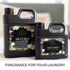 Two bottles of laundry detergent with floral design labels on a white background