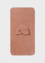 Pink baby blanket with a bear face on a light gray background