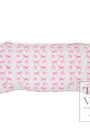 Folded fabric nap mat with pink dog pattern on a white background
