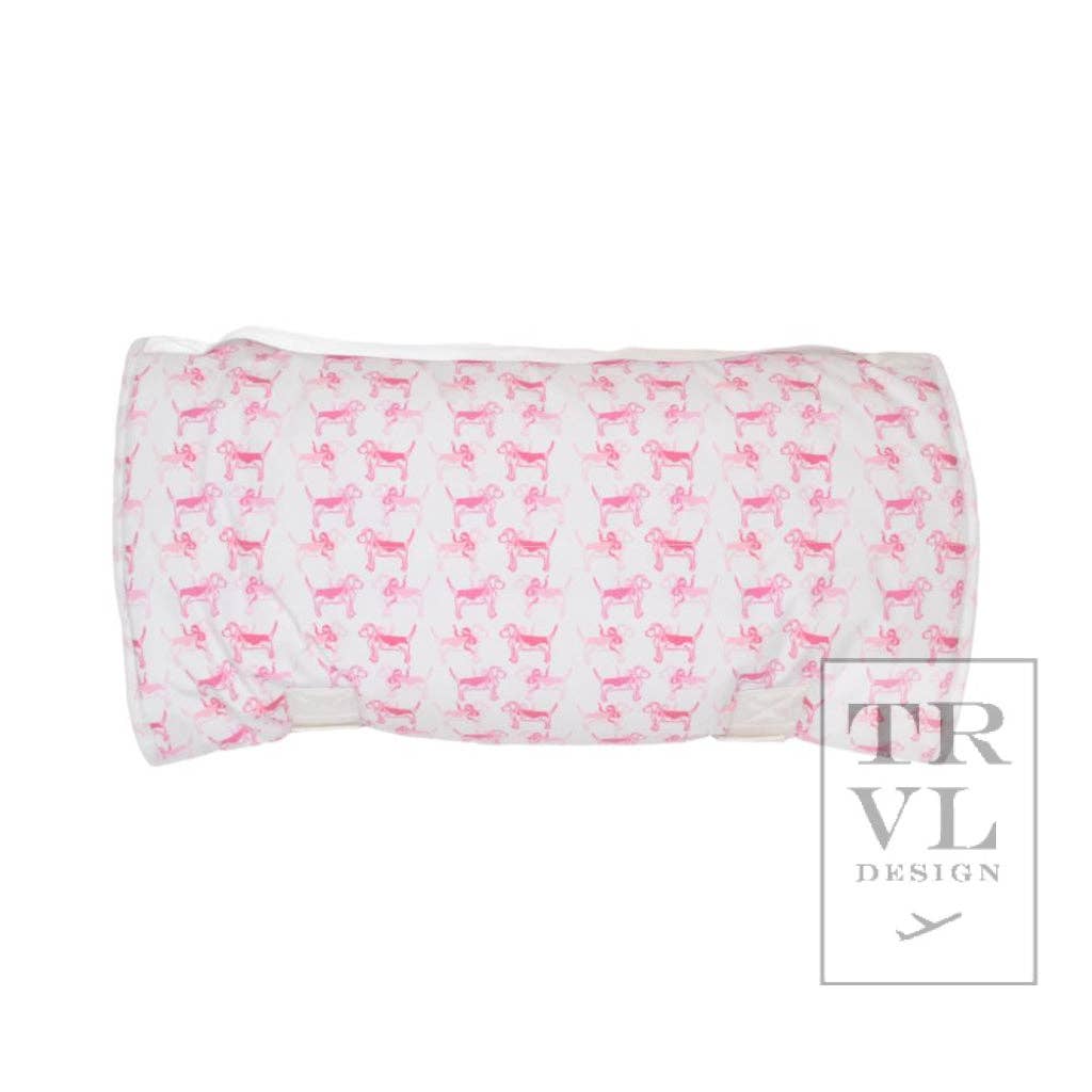 Folded fabric nap mat with pink dog pattern on a white background