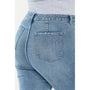 Light blue jeans with a pocket detail on a white background