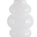 White ceramic vase with a textured design on a white background