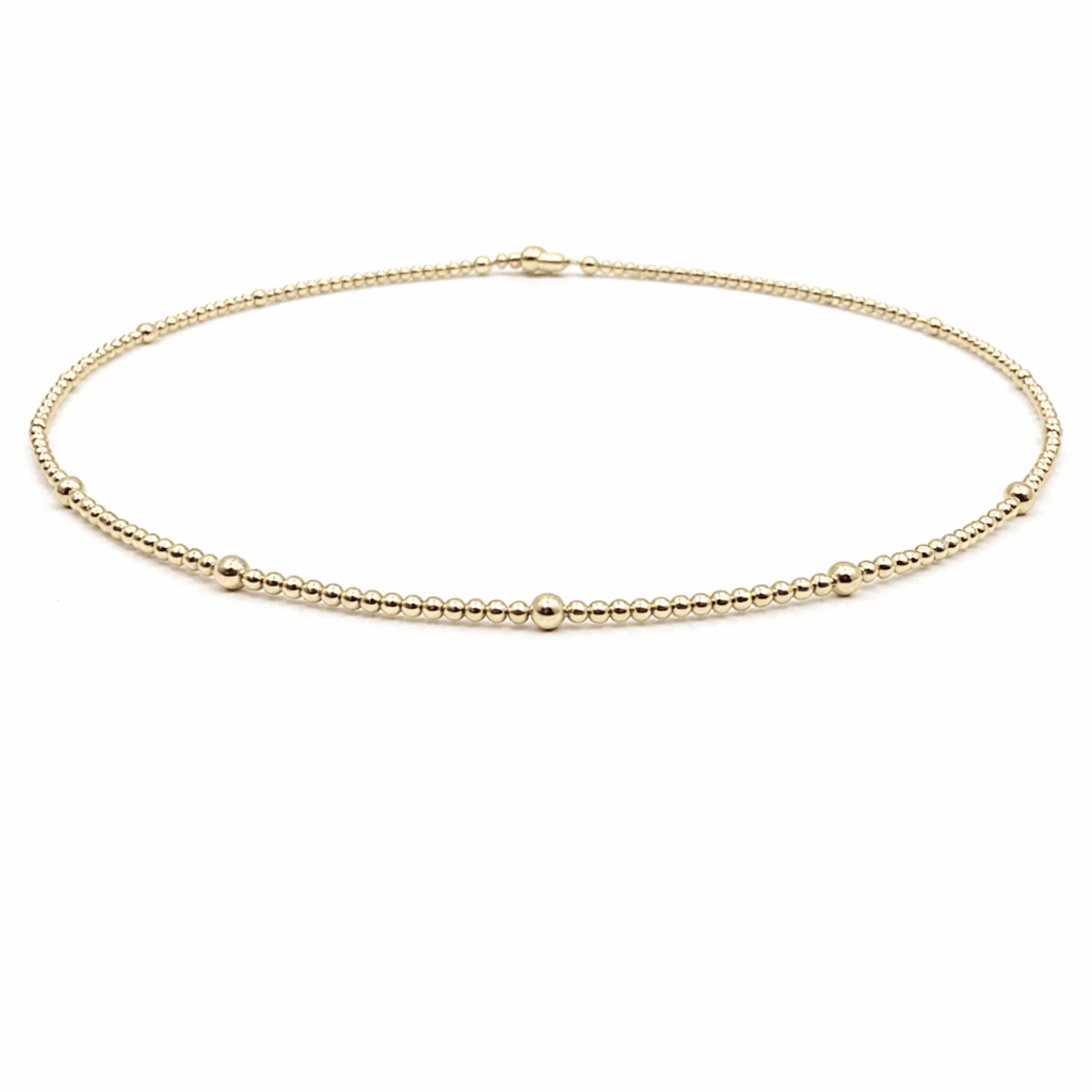 Gold necklace on a white background