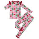 A two-piece children's pajama set featuring a festive holiday pattern of red, green, and white checkered squares on a white background, with solid red cuffs and collar trim.