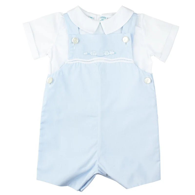 Light blue romper with white collar and buttons on a white background