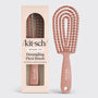 Detangling flexi brush with packaging on a white background