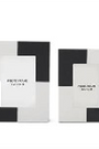 Two black and white geometric patterned boxes on a white background