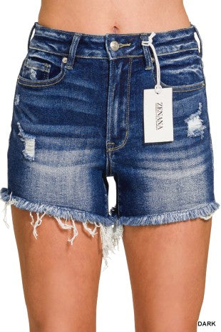 Blue denim shorts with a brand tag on a white background