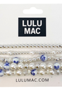 Set of pearl and blue flower hair ties on a LULU MAC branded card.