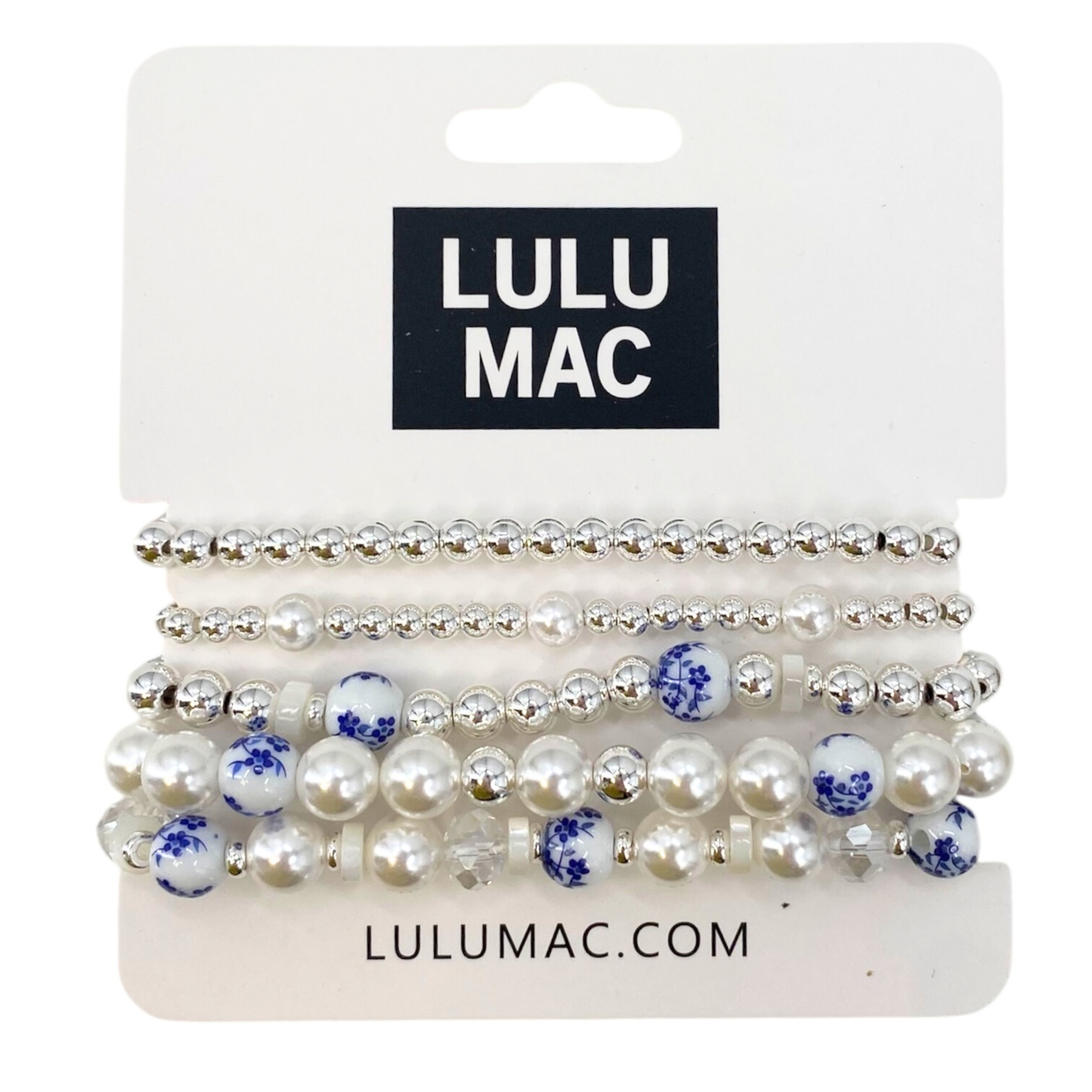Set of pearl and blue flower hair ties on a LULU MAC branded card.