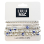 Set of pearl and blue flower hair ties on a LULU MAC branded card.