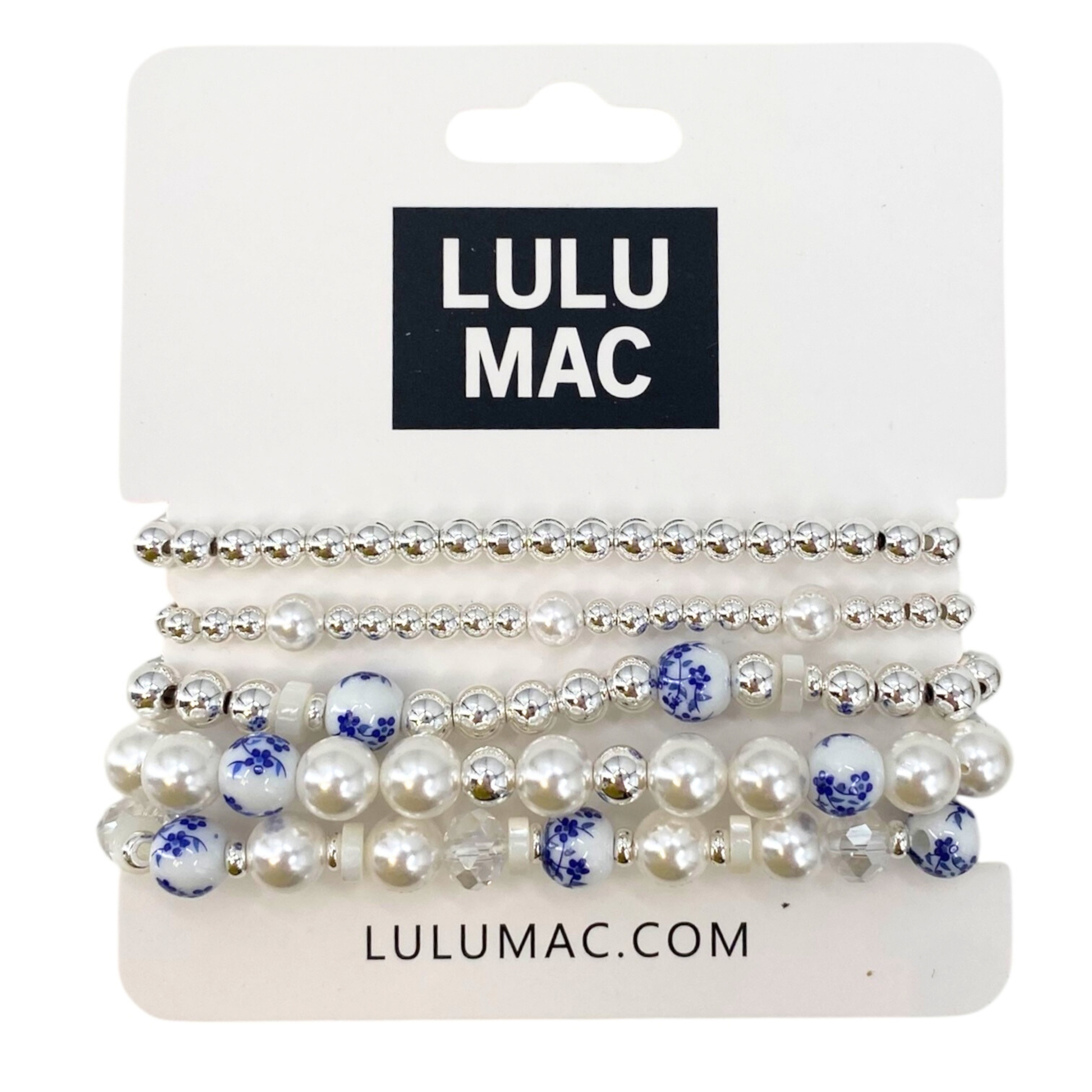 Set of pearl and blue flower hair ties on a LULU MAC branded card.