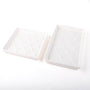 Pair of white textured ceramic towel trays, rectangular with raised grid pattern