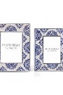 Two decorative picture frames with floral patterns on a white background