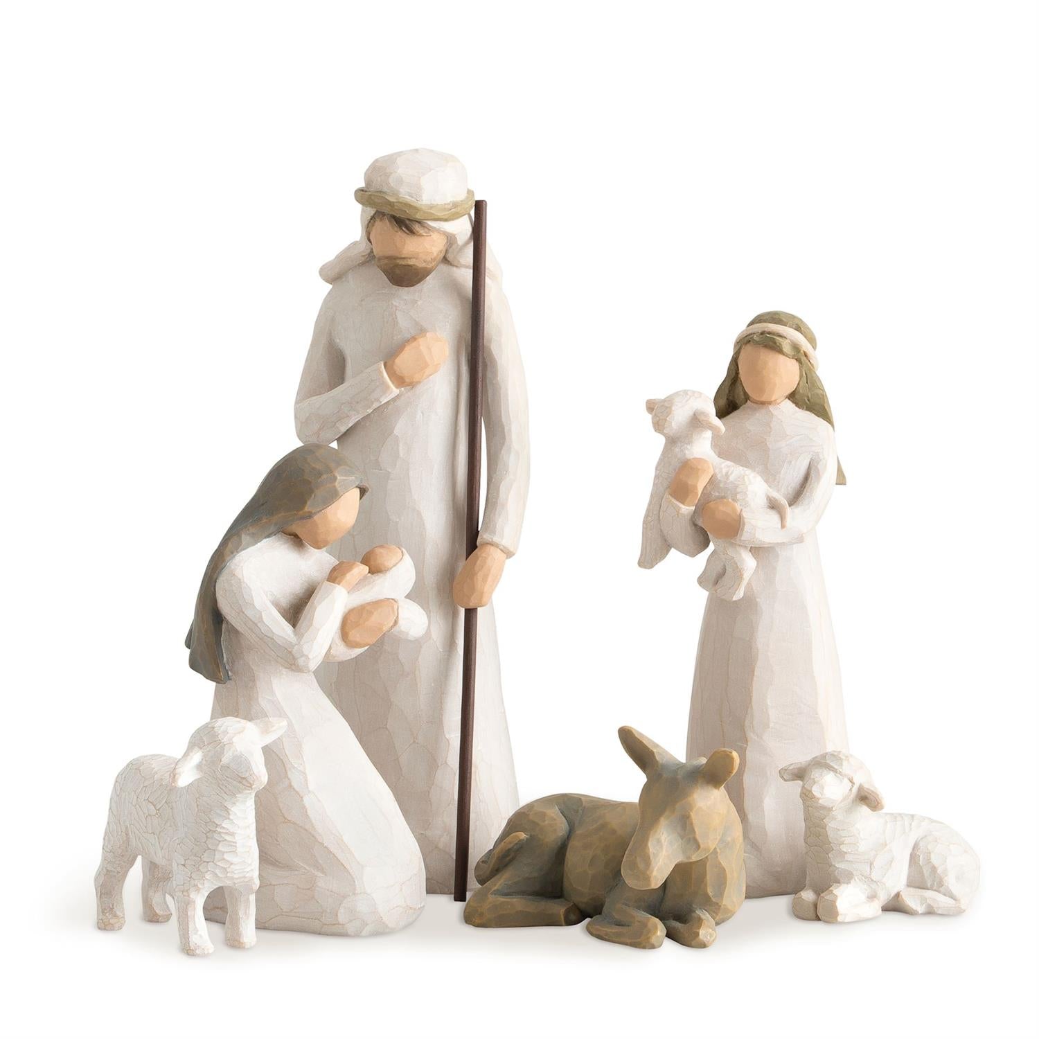 Nativity scene figurines with Mary, Joseph, baby Jesus, and animals on a white background
