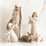 Nativity scene figurines with Mary, Joseph, baby Jesus, and animals on a white background