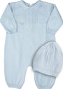 Light blue knitted baby romper with matching hat on a white background