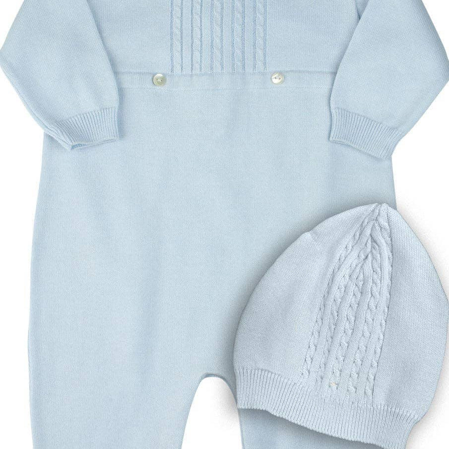 Light blue knitted baby romper with matching hat on a white background