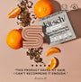 Kitsch Rice Water Protein Solid Shampoo Bar with oranges and tea leaves on a pink background
