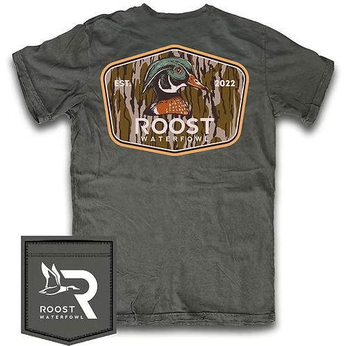 A dark gray crewneck t-shirt featuring a large back graphic of a mallard duck inside a camouflage-style shield with the text 'ROOST WATERFOWL' and 'EST. 2022'.