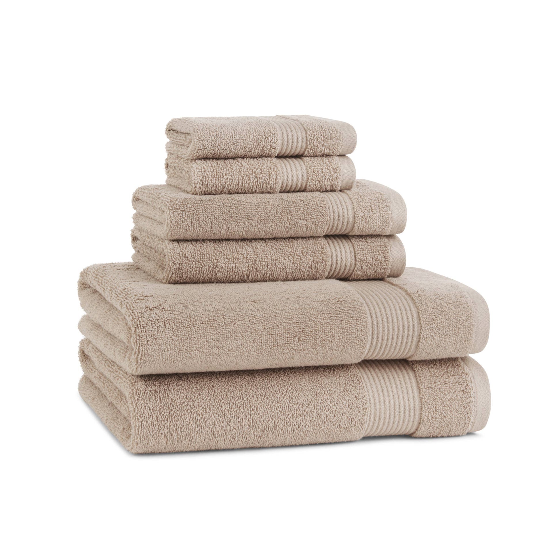 Stack of beige towels on a white background