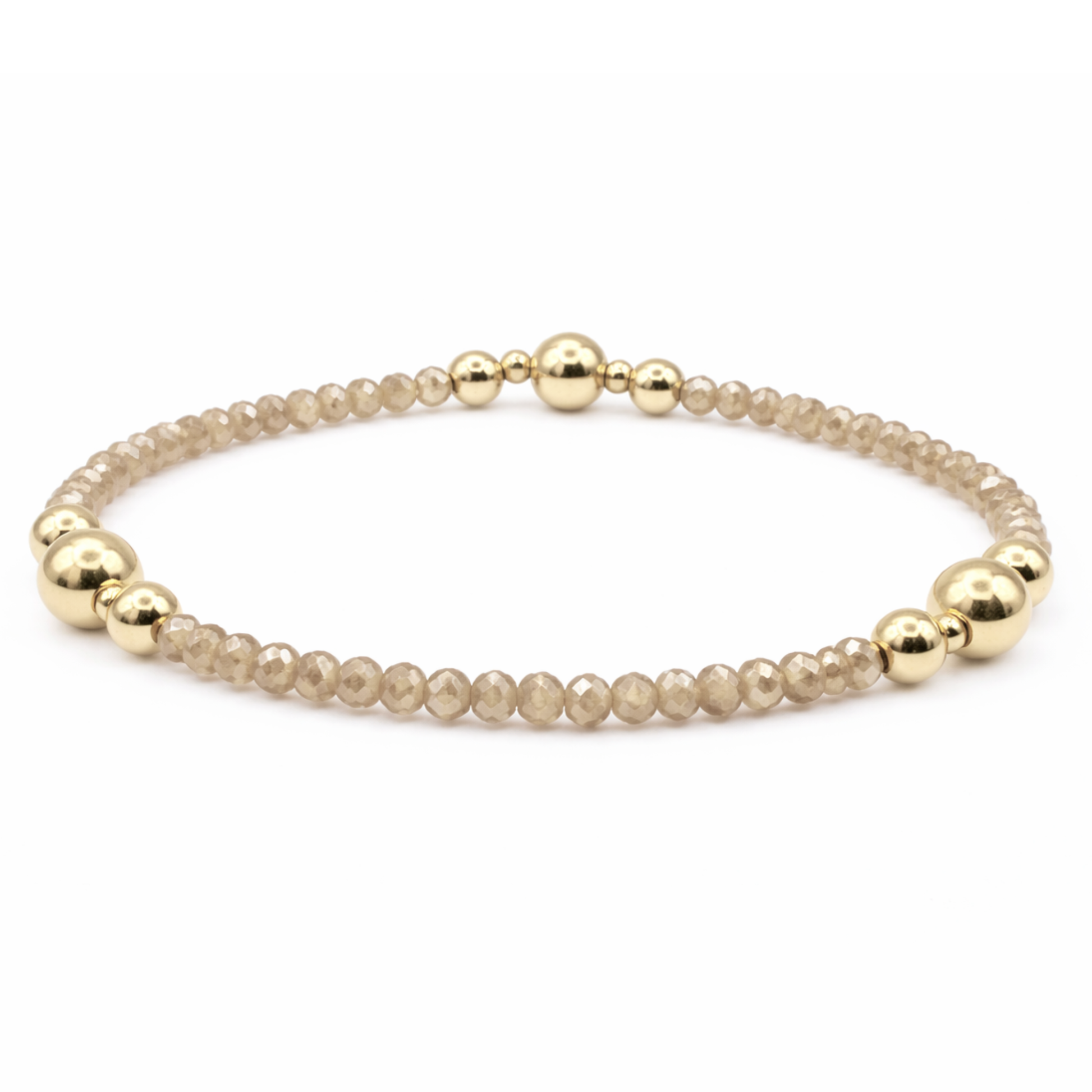 Bracelet with gold and beige beads on a white background