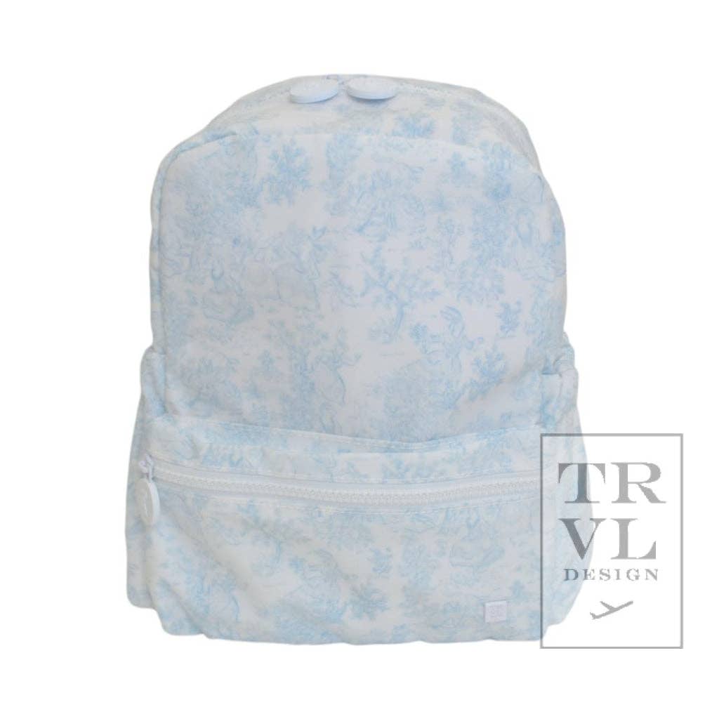 Light blue tie-dye backpack on a white background with 'TRVL Design' branding.