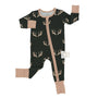A baby long-sleeve footed sleeper in black with a tan deer antler pattern, featuring tan cuffs and a tan front zipper, shown on a white background.