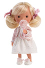 Doll with blonde hair, pink ribbons, and a white dress holding a pink flower on a white background