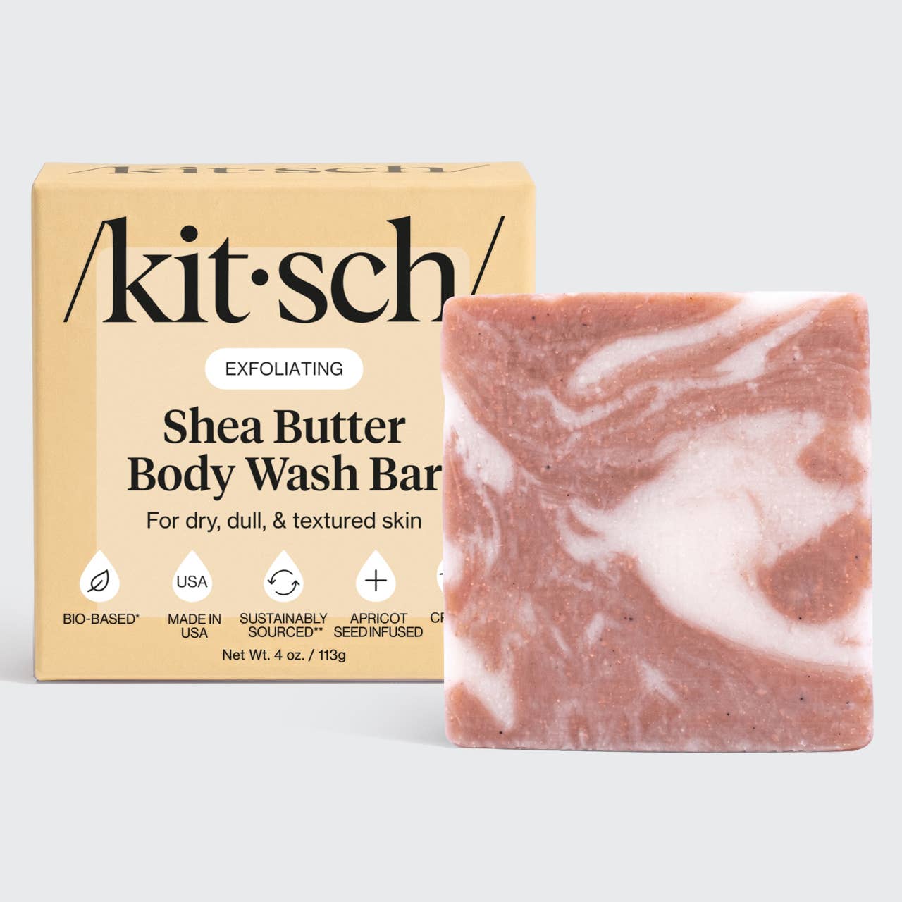 Shea butter body wash bar with packaging on a light gray background