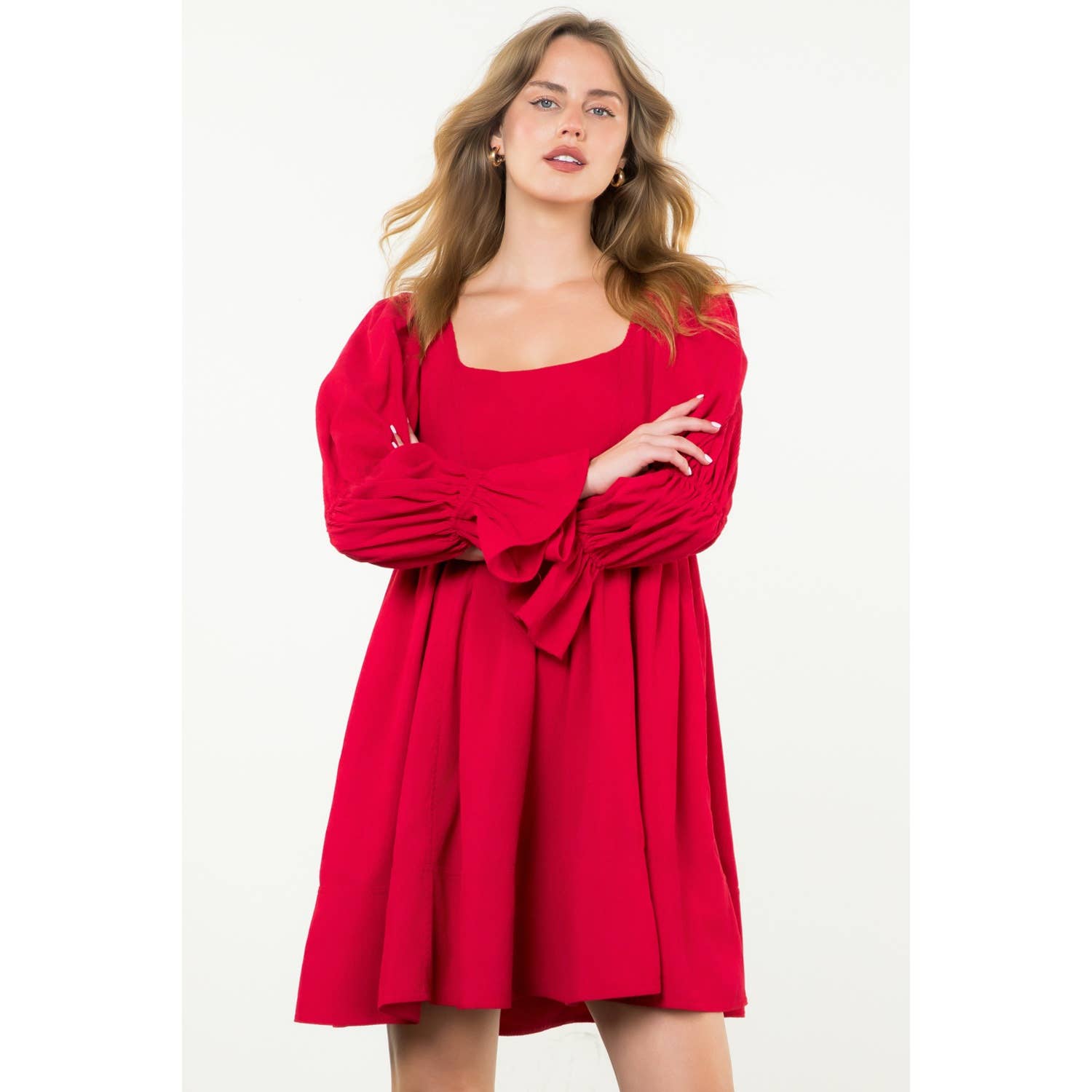 Woman wearing a red dress on a white background