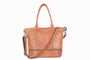 Brown leather handbag with a shoulder strap on a white background