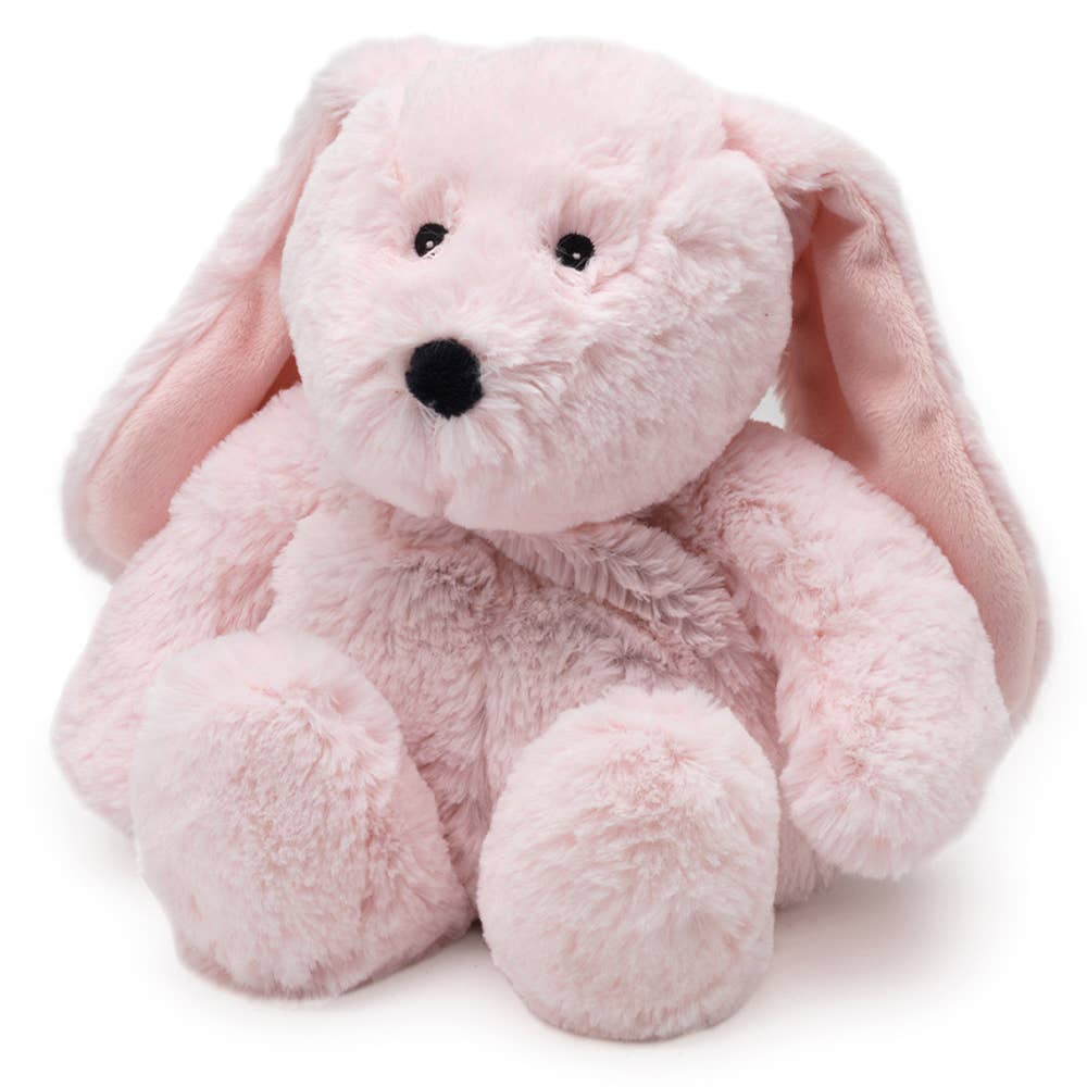 Pink plush bunny toy on a white background