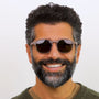 Man wearing sunglasses with a neutral background
