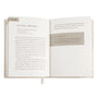 Open devotional book showing 'Living Boldly' page and 'Go For It' heading