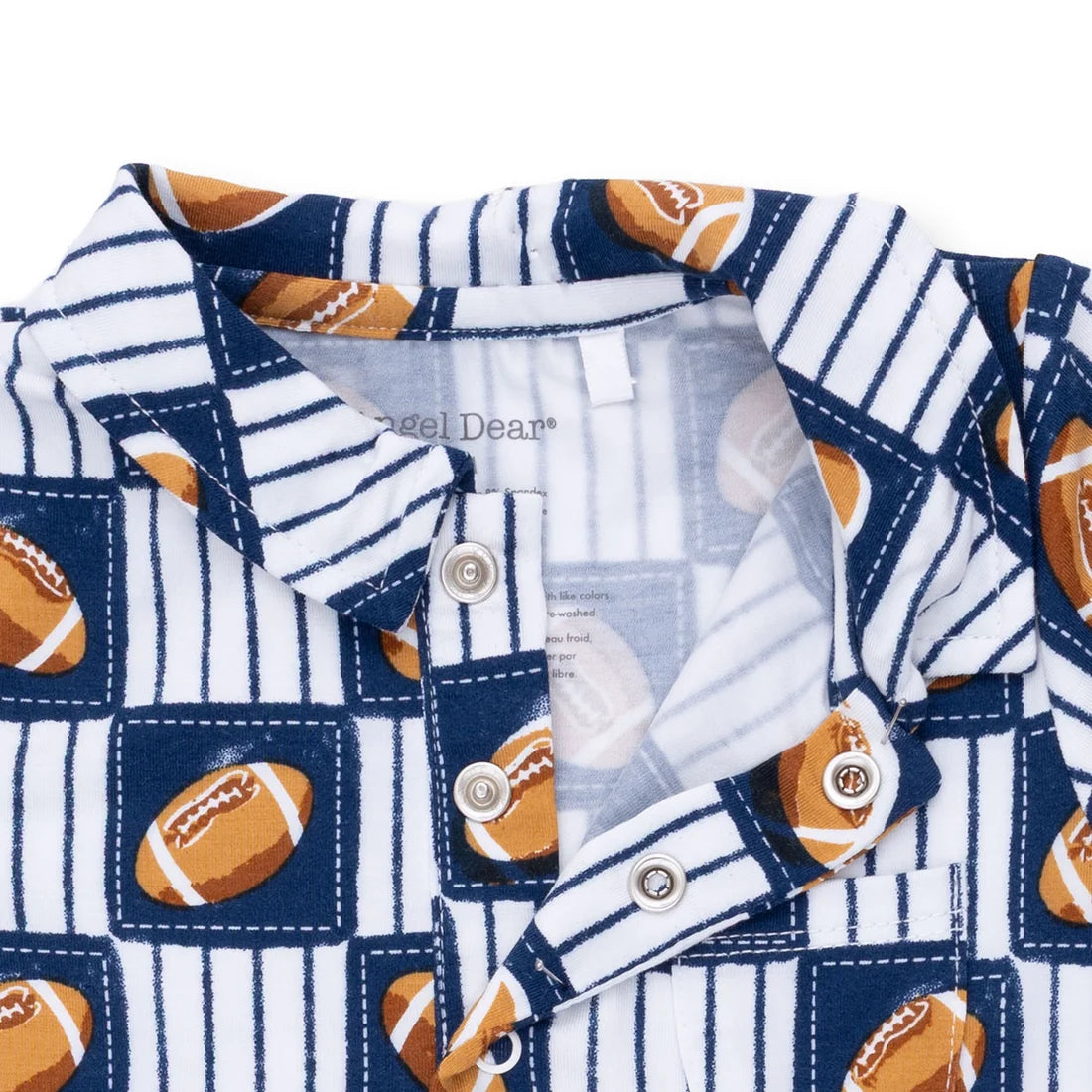 Close-up of a children's collared shirt with a navy and white pinstripe pattern and football motifs, featuring snap buttons and a visible Angel Dear brand label.