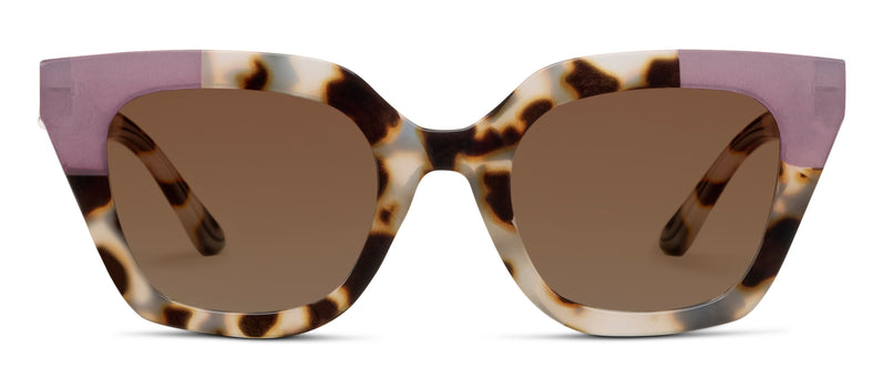 Sunglasses with tortoiseshell frame with pink detail and brown lenses on a white background