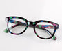 Multicolored eyeglasses on a white background