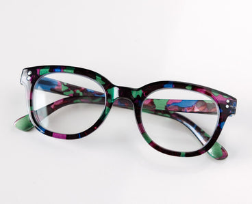 Multicolored eyeglasses on a white background