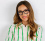 Woman wearing glasses and a striped shirt with a white background