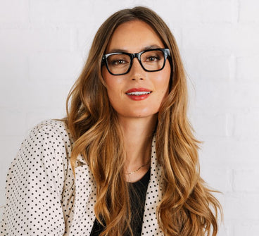 Woman wearing glasses with a white background