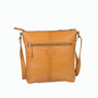 Tan leather crossbody bag on a white background