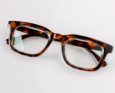 Tortoiseshell eyeglasses on a white background