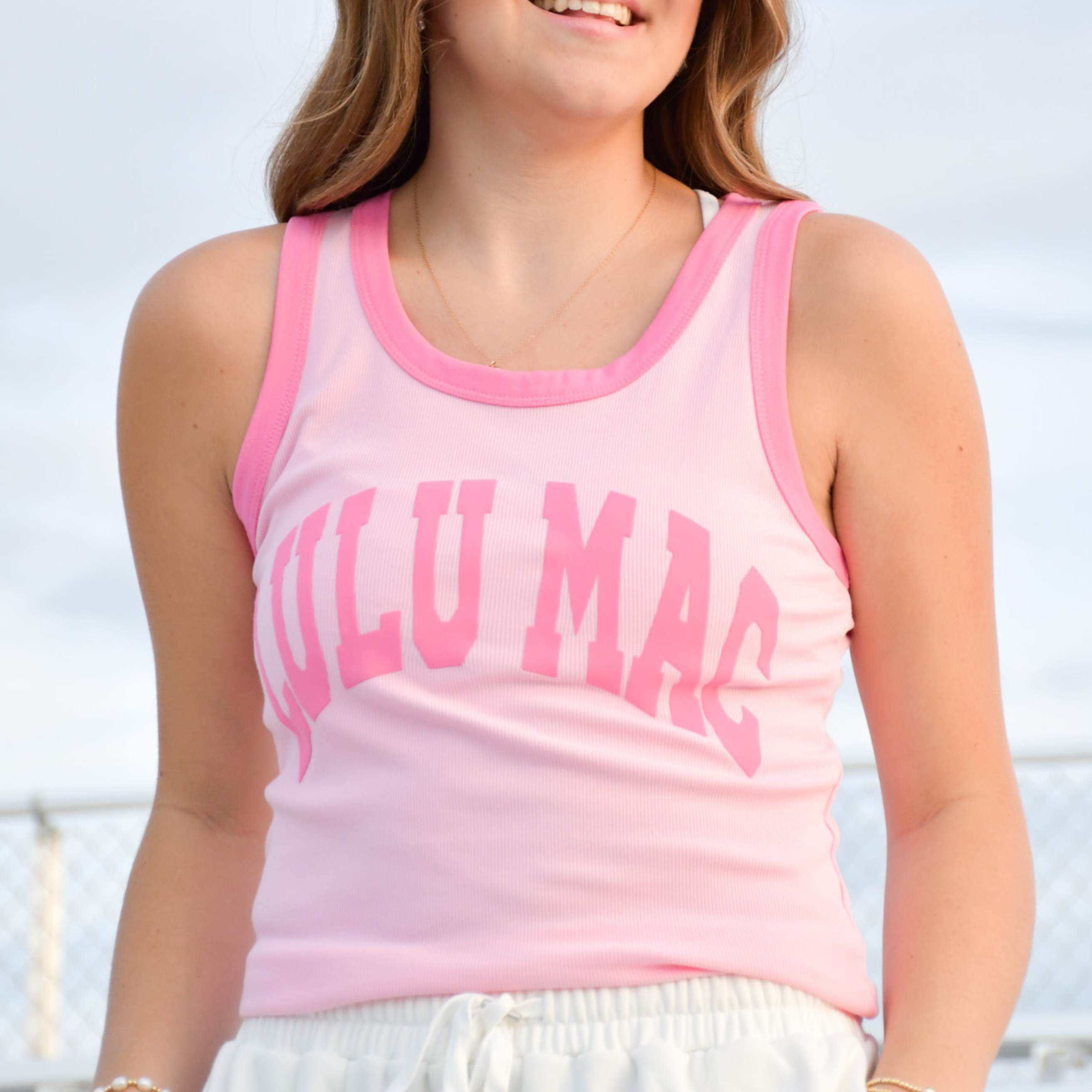 Girls' light pink sleeveless tank top with bubblegum pink trim and large front lettering