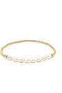 Gold bracelet with pearls on a white background