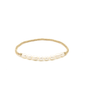Gold bracelet with pearls on a white background