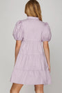 Lavender dress with puff sleeves on a plain background