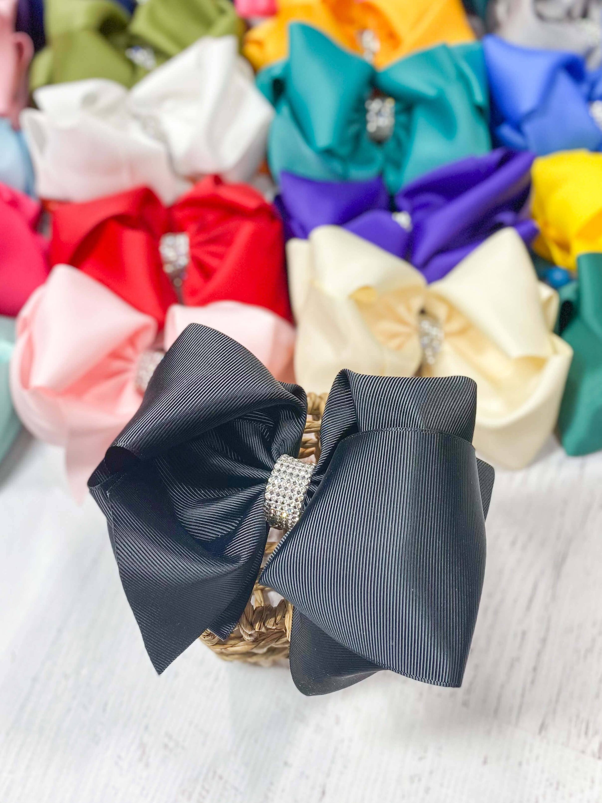 Gray bow with a rhinestone center on a white background